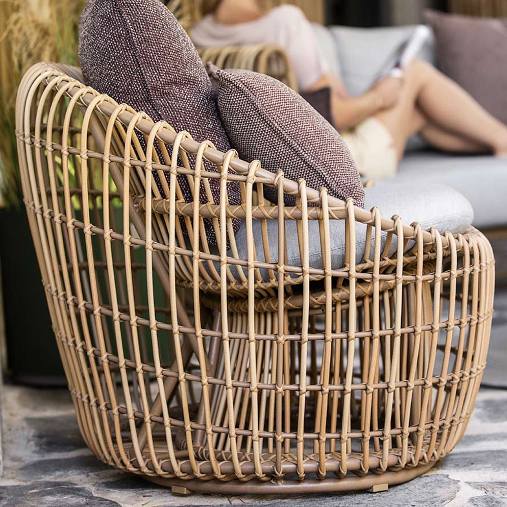 Austin rattan outdoor bucket chair with cushioned wooden nest; A clearance sale